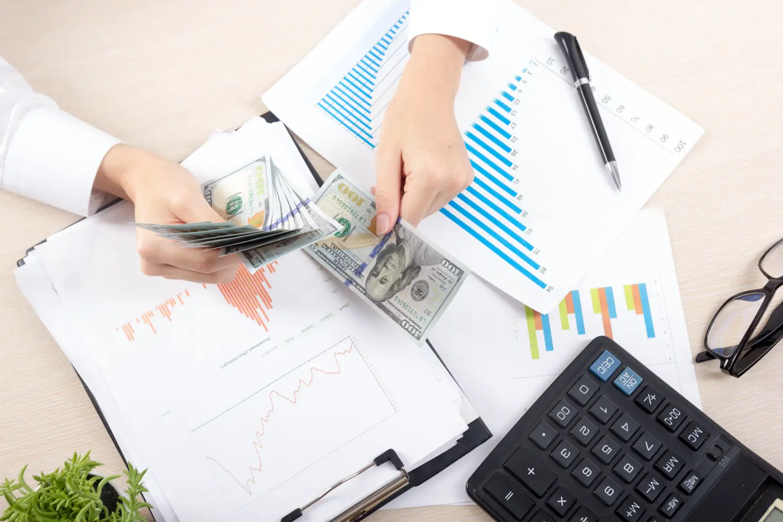 Business owner counting money for licensing fees.