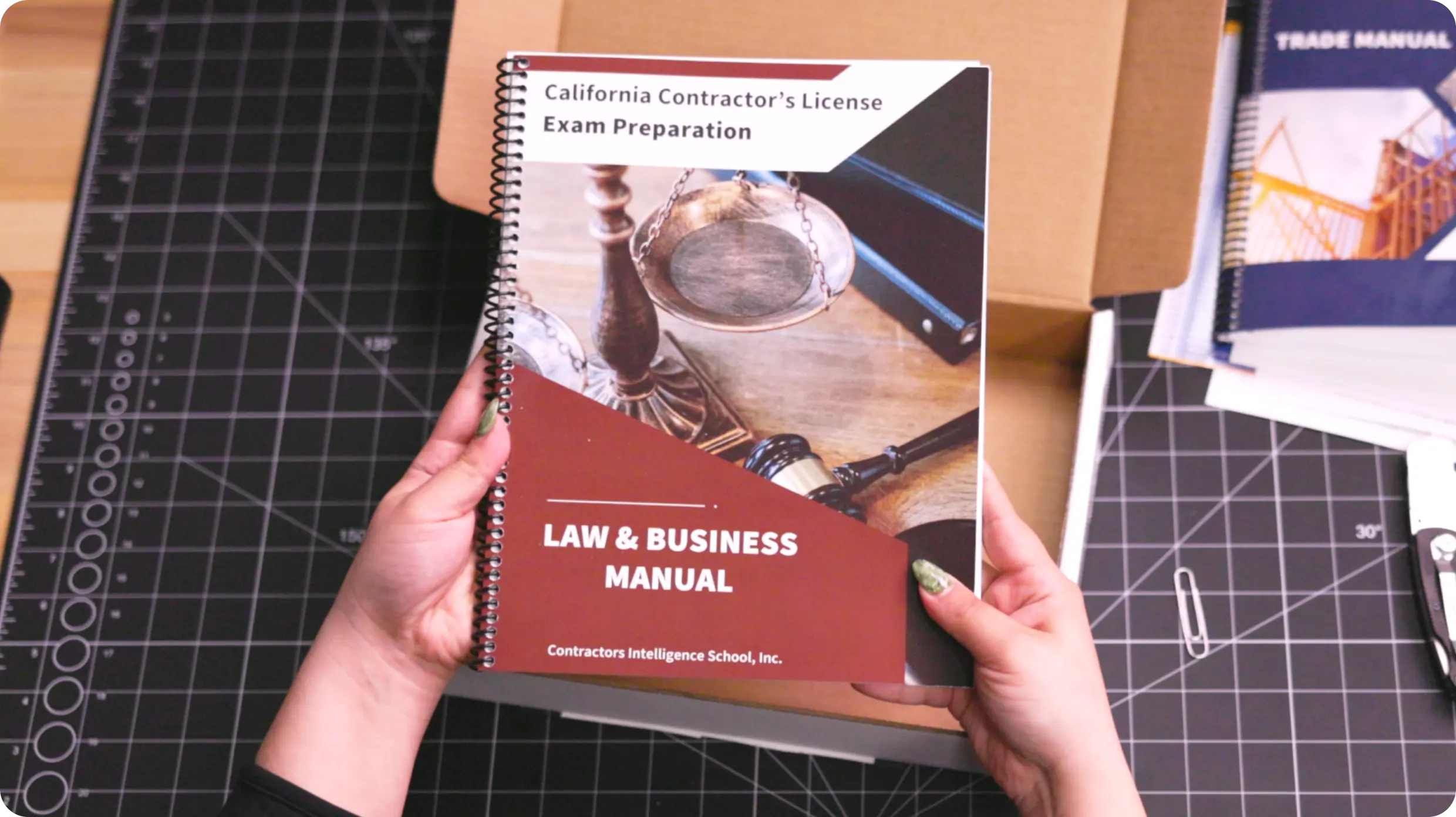 Student studying with printed manuals